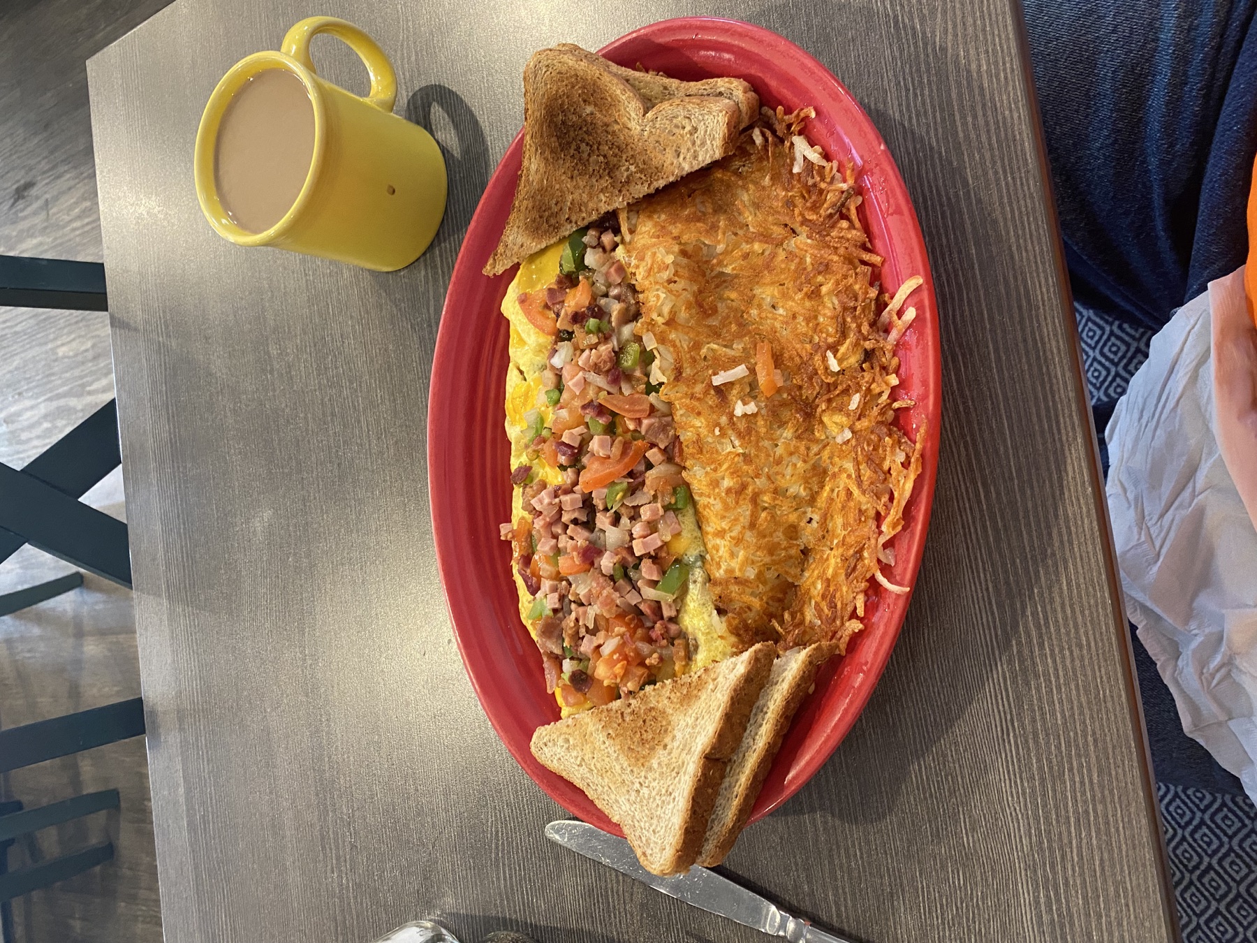 Omelet, hash browns, toast, and coffee